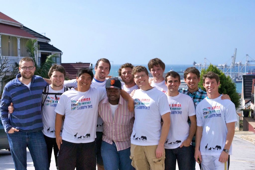Khaya (center, wearing the hat) with the men from the 2012 summer missions team