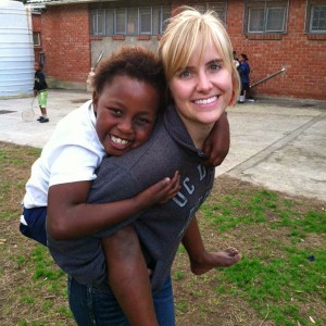 Emma, a senior at UC Davis, with a young girl named Sinesipho in a township in South Africa